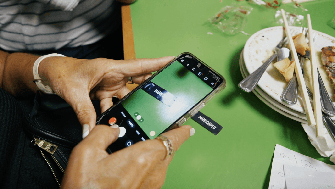 Someone scanning the QR code on a Manscaped fortune cookie fortune